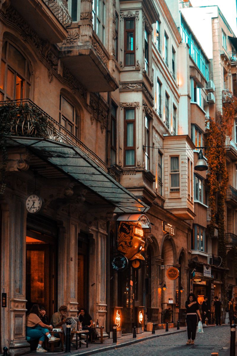 Exterior of the property, classic balconies and windows over the pavement.